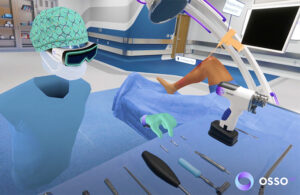 This is an Osso VR marketing image showing someone using its new Hand Control feature in its virtual reality based surgical training system.